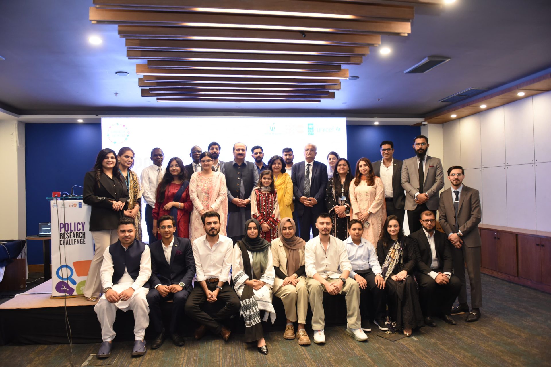 Prime Minister's office 
Youth Affairs wing 

Islamabad, Pakistan

  6th June 2024: Empowering Young People to Shape Inclusive Climate Policies Through Policy Research Challenge

Under the umbrella of Generation Unlimited, the Youth Policy Lab (YPL) platform has emerged, bringing together UN agencies—UNICEF, UNFPA, UNDP—and the Prime Minister’s Youth Programme (PMYP) in a synergistic collaboration with the School of Leadership Foundation (SoLF). This coalition introduced the Policy Research Challenge (PRC) in 2023, marking a significant stride in involving young people at the policy level. Through the PRC, the YPL gives young people a platform to have their voices heard in policy decisions, ensuring their unique needs are considered during important developmental stages.
To mark the culmination of the Policy Research Challenge, a pivotal roundtable was conducted to stir the dialogue among policymakers from various ministries, private sector stakeholders and young researchers. The event also aimed to bridge the divide between research and policy formulation, and advocating for the inclusion of young people in research and policy recommendations. The young researchers employed a transdisciplinary approach to climate adaptation, exploring issues related to water, education, health, smog, agriculture, and community resilience across districts including Lahore, Johi, Skardu, Swat, Lasbela, Hub, Bahawalpur, and Karachi. This approach highlights the significance of climate adaptation for human capital development in Pakistan.
Rana Mashood, Chairperson of the Prime Minister’s Youth Program, delivered an impactful and insightful keynote address, emphasizing the pivotal role that young people play in addressing the global challenge of climate change. He remarked, "Supporting young people and ensuring their inclusion in the policy-making process to combat climate change is not just a matter of importance; it is an absolute necessity. The innovative ideas and unique perspectives that the youth bring to the table are crucial components in the development of effective and inclusive climate policies. These policies are not only aimed at addressing the current environmental crises but also at paving the way for a sustainable and resilient future. The involvement of young people ensures that these policies are forward-thinking and comprehensive, taking into account the long-term impacts and diverse needs of all communities. By harnessing the creativity, energy, and commitment of the youth, we can drive meaningful change and create a legacy of sustainability for future generations. Their active participation is essential in transforming our approach to climate action and in achieving the ambitious goals set forth by our global environmental agenda."
Representatives from UNICEF, UNDP, and UNFPA attended the event, underscoring the strategic importance of youth empowerment and evidence-based policymaking in achieving sustainable development goals.

Dr. Rubina Ali, Assistant Representative of UNFPA, remarked, "Combating climate change requires innovative and community-based solutions. It requires a new perspective, and who better to offer these solutions than young people who have only known a world grappling with its consequences."
Inoussa Kabore. Deputy Representative (Programmes) UNICEF Pakistan, highlighted how these researchers have taken a transdisciplinary approach to the topic of climate adaptation and have explored issues faced by them and their communities with regards to water, education, health, smog, agriculture, and community resilience.
A highlight of the roundtable was the Policy Interface Matchup, where adolescent and youth researchers engaged directly with ministry representatives, facilitating a constructive dialogue to align adolescents and youth-driven research with governmental policies, ensuring inclusivity, responsiveness, and efficacy in meeting the needs of Pakistan’s diverse communities. 

The Policy Research Challenge stands as a testament to the transformative power of adolescents and youth in shaping a sustainable world, with their contributions poised to impact future policymaking. Moving forward, these collaborative efforts will continue to inspire positive change, integrating young people's perspectives into national policies to build a more equitable and resilient future.
the pakistan times
www.thepakistantimes.com.pk
