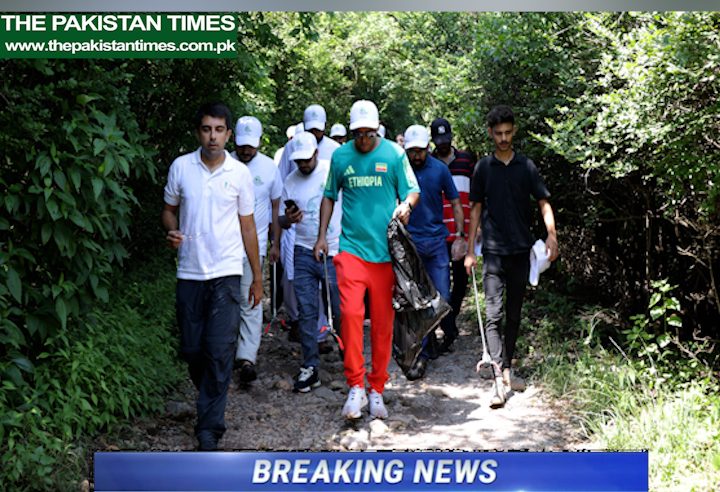 PRESS RELEASE 
ISLAMABAD, August 31st , 2024
Green Legacy: Ethiopian Ambassador Dr. Jemal Leads Cleaning Drive at Trail 5, Margala Hills 

H.E. Dr. Jemal Beker, Special Envoy and Ambassador of the Federal Democratic Republic of Ethiopia to the Islamic Republic of Pakistan, on Saturday spearheaded a cleaning drive at the Trail 5 in Islamabad to purge the Margala Hills of trash that posed serious threat to the wildlife in the National Park.
The drive, jointly organized by the Ethiopian Embassy Islamabad, GhoomLay and Studio One, was launched as a part of the Ethio-Pakistan Fraternity Under the Green Legacy Initiative of the Prime Minister of Ethiopia H.E. Dr. Abiy Ahmed. 
Individuals from the all walks of the life including government officials, diplomatic community, civil society, youth and media participated in the cleaning drive, which was aimed at fostering Ethio-Pakistan fraternity by pursuing joint efforts for better future of both the countries.
Talking to the media on the occasion, H.E. Dr. Jemal Beker said today gathering was meant to send a message that mass mobilization of the human and financial resources was a solution to resolve the contemporary and new normal challenges such as climate change.
He said, “Ethiopia is building a green economy by planting more than 40.5 billion seedlings of fruits, vegetable and fodder in the last five years that has created jobs and ensured food security in Ethiopia. The record breaking plantation was undertaken under the Green Legacy Initiative which is inspired from Medemer philosophy of our Prime Minister which advocates for mass mobilization and alignment of the resources”.
“We have launched this Green Legacy Initiative in Pakistan as I personally went to all the cities of Pakistan and mobilizing all segments of the society to mitigate the serious threat of climate change,” he said, urging the youth to be on forefront for such an important cause.
He expressed his gratitude for the Islamabad Wildlife Management Board, GhoomLay, and Studio One for partnering with the Ethiopian Embassy Islamabad on such a humanitarian and kind initiative.
The Ambassador also lauded the Government of Pakistan’s commitment for working with Ethiopia to enhance bilateral regional and multilateral cooperation between the two countries in various areas such as economy, education, health, climate change, culture and technology transfer.
Chief Executive Officer of GhoomLay (Pvt) Limited Muhammad Haris thanked the Ethiopian Embassy Islamabad for partnering with his organization and others to clean the Trail 5 Margala Hills. 
He reiterated commitment to take the needful initiatives for protecting environment in the Federal Capital Islamabad and other cities.
The Pakistan Times
Pakistan Times
