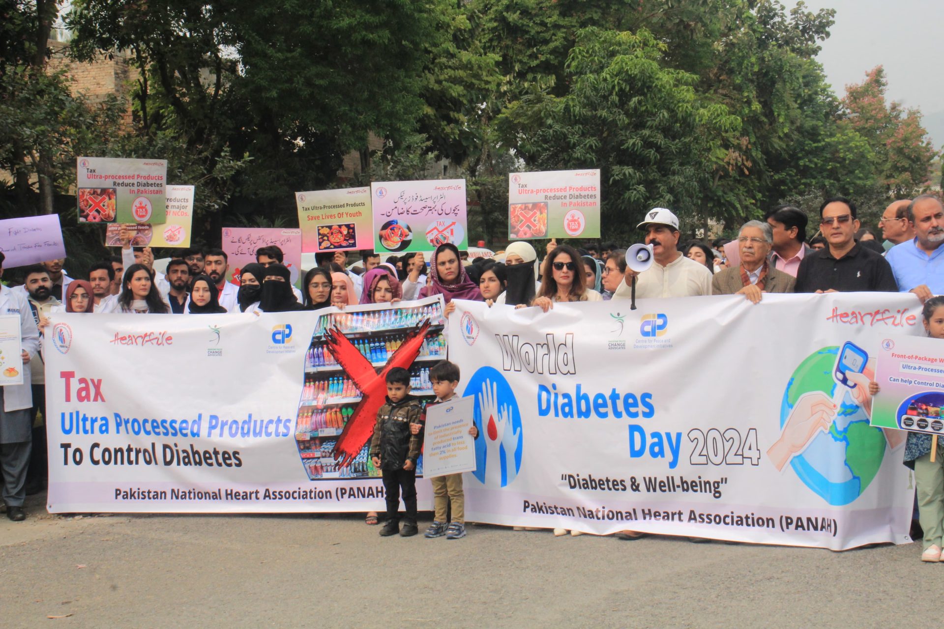 Press release: 14th Nov 2024. Pakistan on a Way to 62 Million Diabetics – Experts Pandemic of diabetes calls for urgent policy action by government including taxing sugary drinks and limiting industrially produced trans fatty acids in all foods. Islamabad. Pakistan is set on the way to have 62 million diabetic by 2045. The number of people living with diabetes in Pakistan increased from 6.3 million in 2011 to 33 million in 2021 and approximately 36 million in 2024, with an additional one million as pre diabetic. The sharp surge of diabetes has ranked Pakistan a number one country globally in term of prevalence rate of diseases where every third adult Pakistani is diabetic. More than 1100 deaths are attributed to diabetes or its complications daily in Pakistan. If no immediate policy action taken, the situation will further deteriorate. Experts agree that the consumption of ultra-processed foods lurking with industrially produced trans fats, sugar and salt are major contributing factors to the diabetes surg in Pakistan. Trans fats, found in processed foods, fried items, and baked goods, are known to increase insulin resistance, raise bad cholesterol (LDL), and promote inflammation – all of which increase the risk of type 2 diabetes and cardiovascular disease. This was said by representatives of civil society organizations during a walk organized jointly by Pakistan National Heart Association (PANAH), Heartfile, Pakistan Youth Change Advocates, Center for Peace and Development Initiative and others in front of National Press Club Islamabad on world diabetes day. Mr. Munawar Hussain said that sweet drinks are the largest source of the intake of the sugar in the diet. The liquid sugar alters the metabolism of the body, promote excess calorie intake which leads to type 2 diabetes and many other fatal diseases. Several research studies indicate that consumption of sugary drinks has clear link with type 2 diabetes. The regular consumption of sweet drinks may increase the risk of type 2 diabetes by 30 percent, which could be cut down by reducing its consumption. Due to the negative health effects of ultra-processed food and beverage products, several countries have taken effective policy measures to reduce their consumption. These measures include increasing excise tax on these products and enactment of front of pack labeling and warning signs to guide consumers for making healthier food choices, and limiting industrially trans fats to 2 % of the total fats in all food sources. Mr. Sanaullah Ghumman said that higher taxes on sugary drinks proves to be an effective strategy for reducing the prevalence of diabetes and other fatal non-communicable diseases. This approach has been successfully adopted by approximately 50 countries, including Bahrain, Morocco, Oman, Saudi Arabia, the United Arab Emirates, and Qatar. The outcomes of these measures have shown promising results in significantly decreasing the consumption of sugary drinks and lowering the prevalence of diabetes in these nations. Dr. Saba stressed the importance of curbing SSB consumption to combat diabetes. “The link between sugar-sweetened beverages and diabetes is well-documented. As a medical doctor, I can see how excessive sugar intake contributes to the rise of NCDs. Raising excise taxes on all type of sweetened drinks is an evidence based strategy to reduce its consumption and cut down diabetes. Huma Jehangir further emphasized on uniform regulations and stated, “The masses are exposed to ultra-processed products more than ever before. These products not only have excessive levels of sugars and salt but also alarming levels of transfats. She emphasized on urgent policy action by the government at regulatory and legislative level” "World Diabetes Day is a crucial opportunity to raise awareness about the link between industrially produced trans fats and the rising rates of diabetes in Pakistan,” said Mukhtar Ahmed Ali, Executive Director of CPDI. “Trans fats are a significant contributor to this crisis, and it’s essential that we eliminate them from our food system. He urges the government to adopt mandatory standards limiting industrially produced trans fats to less than 2% in all foods, in line with the WHO's best practice policy recommendations. Mr. Afzal Butt said that I and my entire society of journalist will support Taxes campaign and requested government to take immediate the other policy measure like regulating trans fats. Students, civil society representatives, health experts and public health advocates were carrying placards demanding government to take necessary policy steps to reduce the consumption of ultra-processed foods and sugary drinks. They requested FBR and Ministry of finance to increasing tax on sugary drinks and junk foods. They also requested Pakistan Standards and Quality Control Authority to enacting front of pack warning labels on all ultra-processed food and beverage products, and regulating trans fats in all foods. The walk was also attended by Dr. Qayyam Awan Senior Executive vice president Pakistan National Heart Association (PANAH), Mr. Afzal Butt- President Union of Journalist, Mr. Anwar Raza President Islamabad press Club, Dr. Saba- CEO Heart File, Mr. Munawar Hussain-Country Coordinator Global Health Advocacy Incubator (GHAI), Ms. Areeba Shahid- Executive Director of Pakistan Youth Change Advocates (PYCA), Mr. Mukhtar Ahmed Ali- Executive Director Center for Peace and Development Initiative (CPDI), Mr. Sana Ullah Ghumman General Secretary Pakistan National Heart Association (PANAH), representatives of civil society, media, students, teachers, health experts and people from all walks of life.The Pakistan Times Pakistan atimes