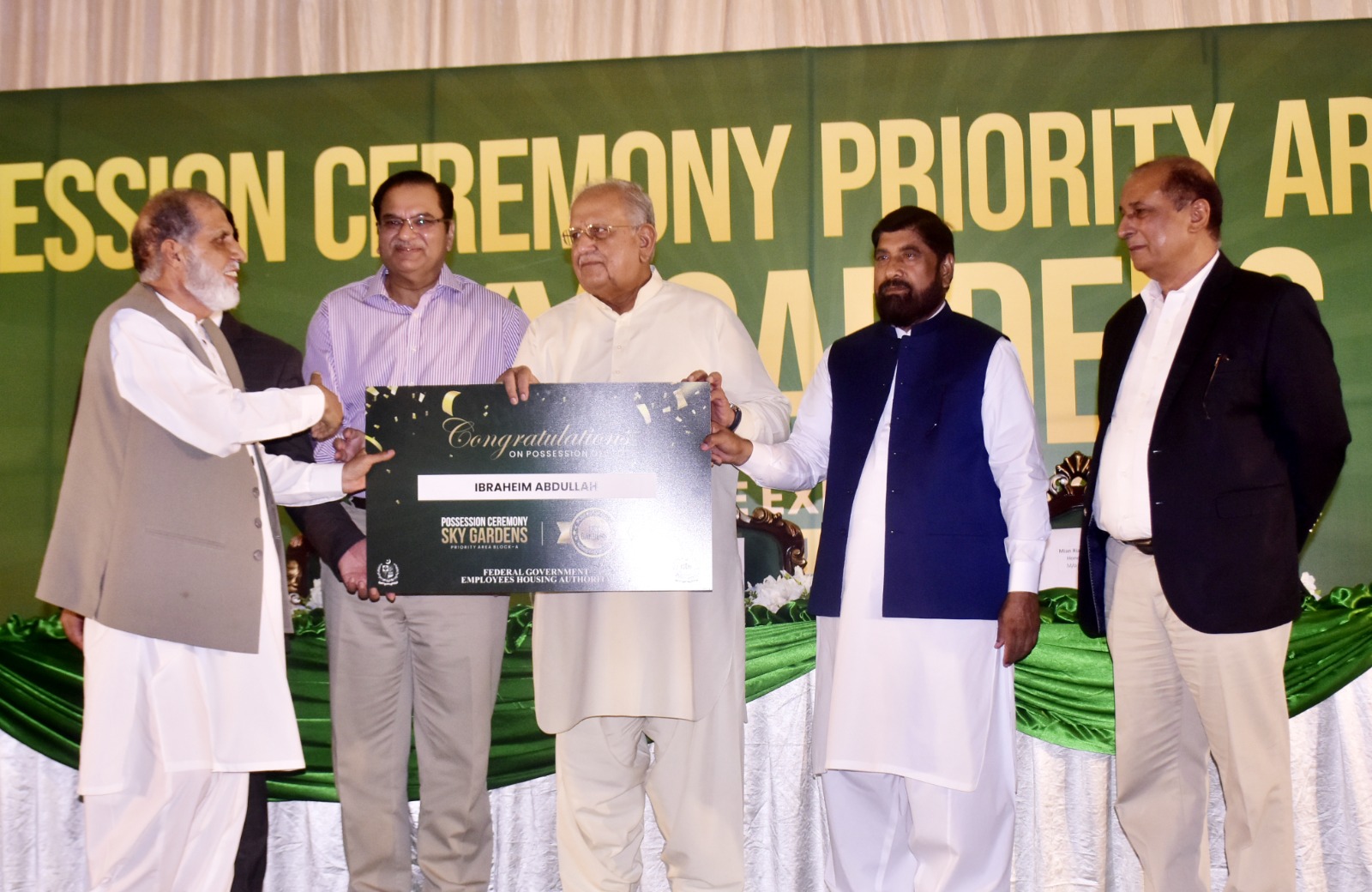 Housing Minister Hands Over Possession of Plots to Allottees in Sky Gardens Housing Project 